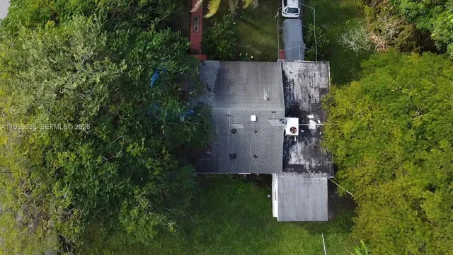 an aerial view of residential house with outdoor space