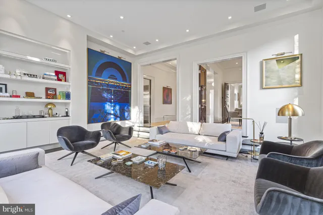 a view of a dining room with furniture wooden floor and chandelier