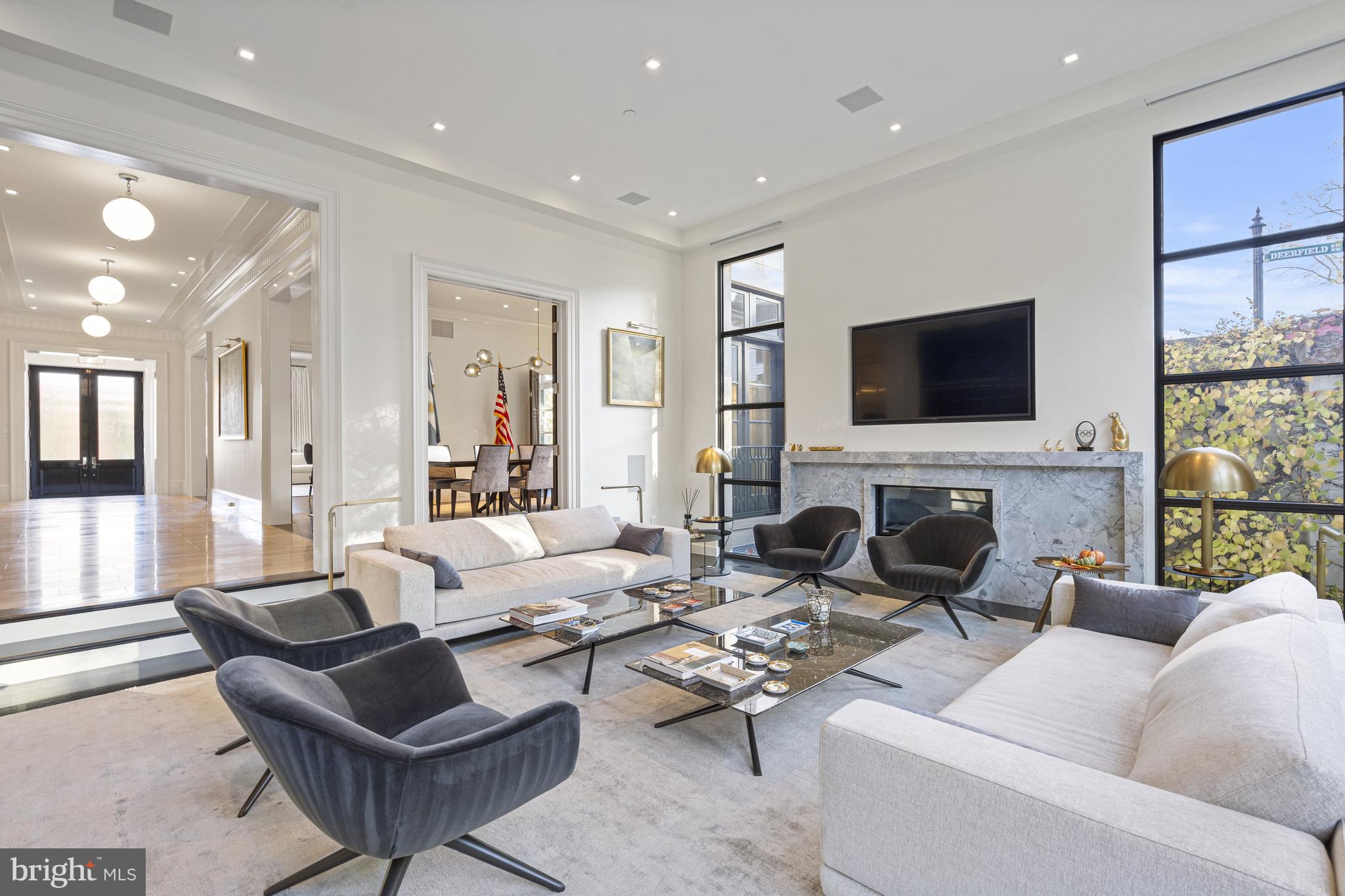 2109 Dunmore Lane Washington, DC 20007 - Photo 18 of 92 a living room with furniture a fireplace and a flat screen tv