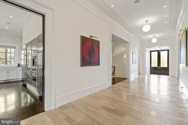 a view of a livingroom with furniture wooden floor and a chandelier
