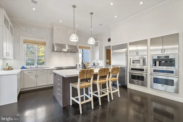 a bedroom with a large bed and a large window