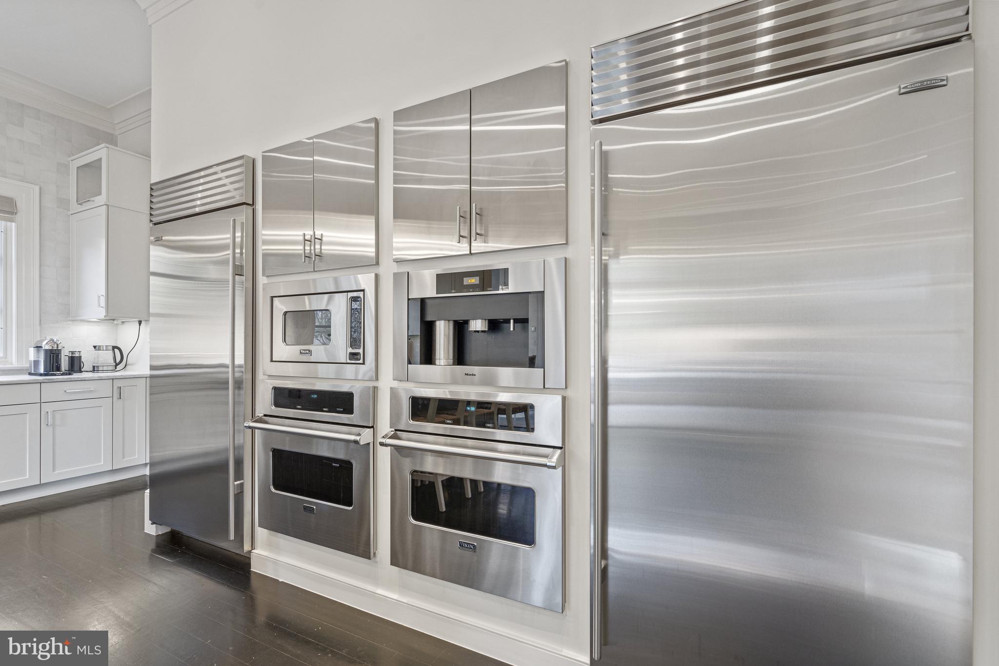 2109 Dunmore Lane Washington, DC 20007 - Photo 22 of 92 a kitchen with stainless steel appliances and white cabinets
