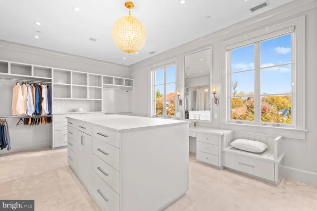a utility room with sink dryer and washer