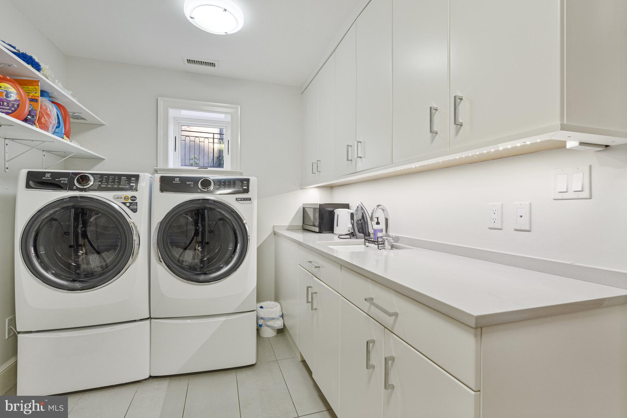 2109 Dunmore Lane Washington, DC 20007 - Photo 79 of 92 a utility room with sink dryer and washer