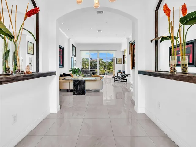 a lobby with furniture and a large window