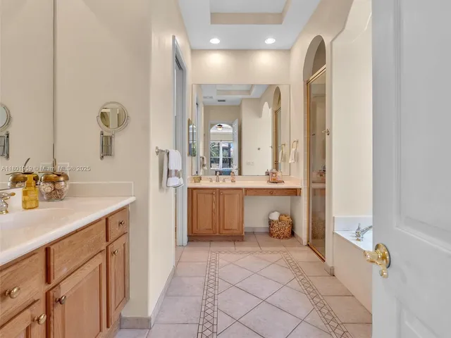 a bathroom with a granite countertop sink mirror and double