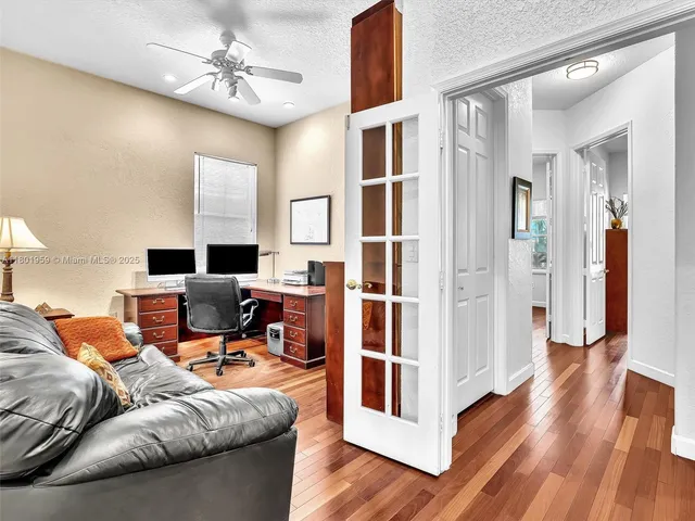 a view of a workspace with furniture and a couch