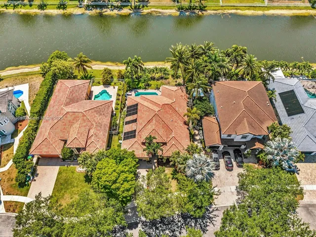 an aerial view of a house with a lake view
