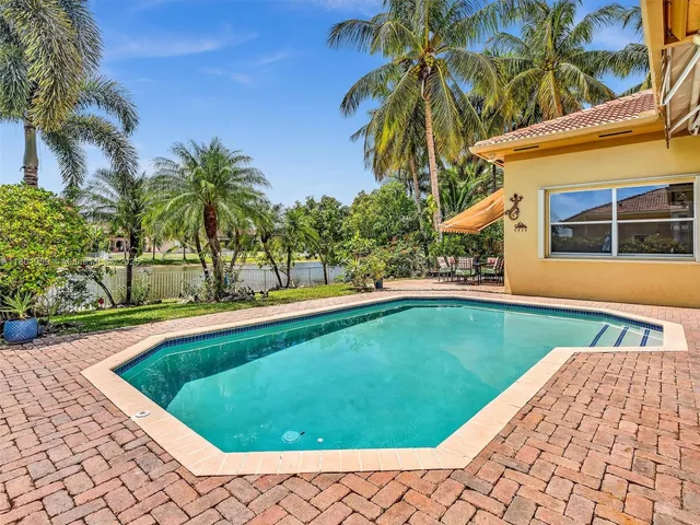 a view of a patio with a table and chairs