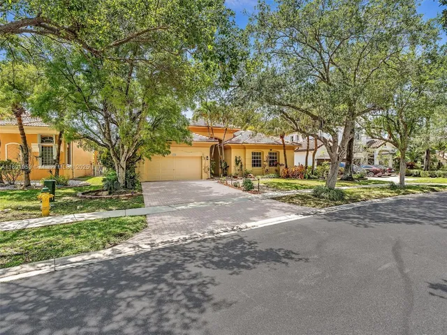 an aerial view of a house with a lake view
