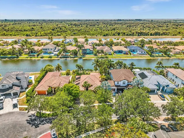 an aerial view of residential building and ocean
