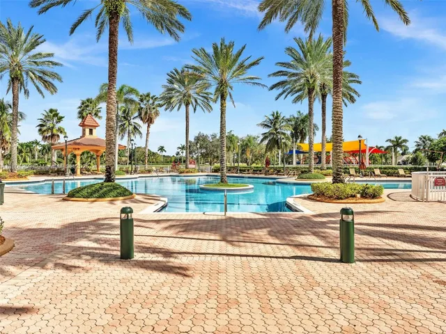 a view of a swimming pool with a yard