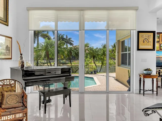 a living room with furniture and flowers