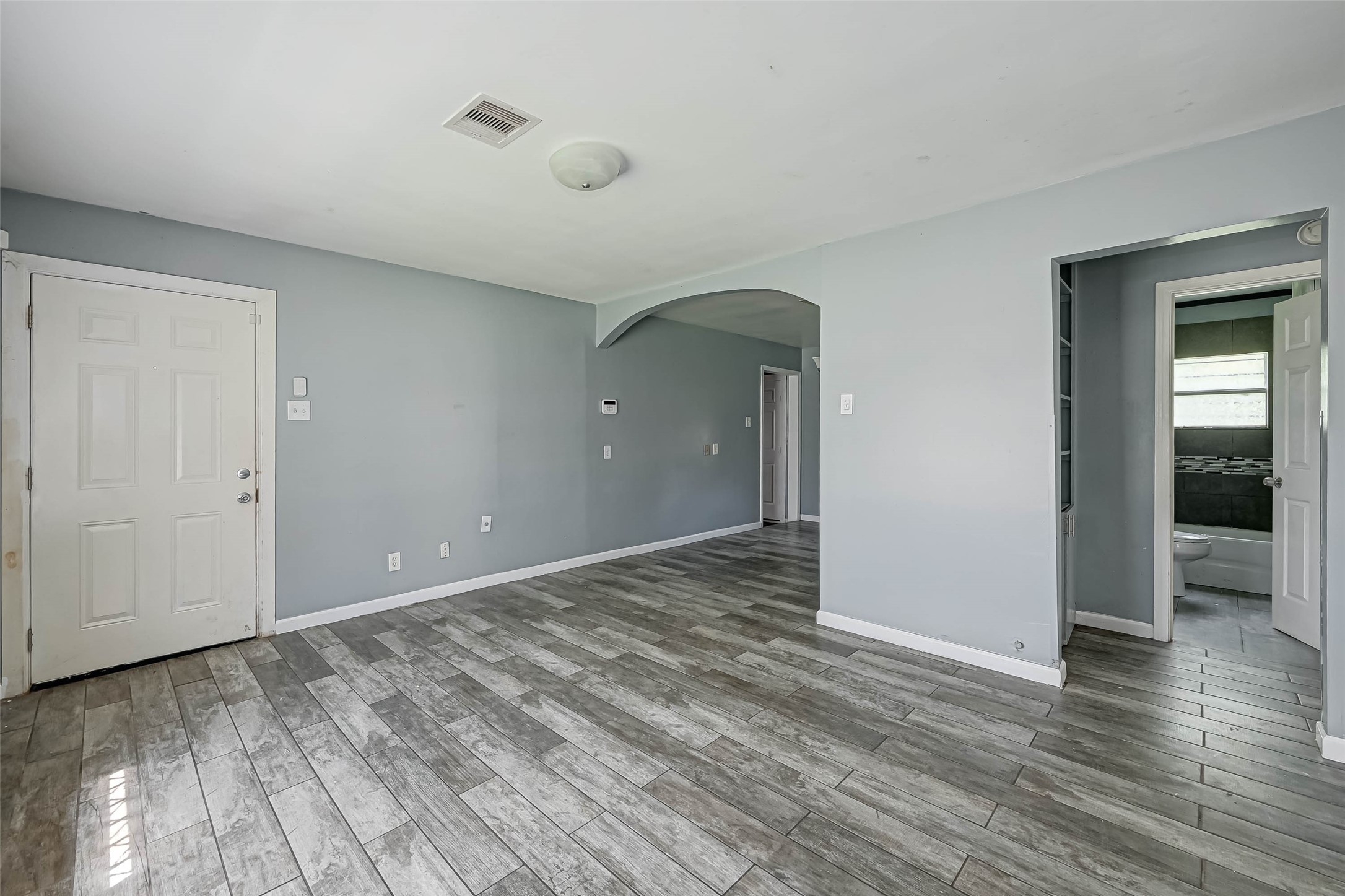 4821 Alvin Street Houston, TX 77033 - Photo 2 of 15 a view of an empty room and window