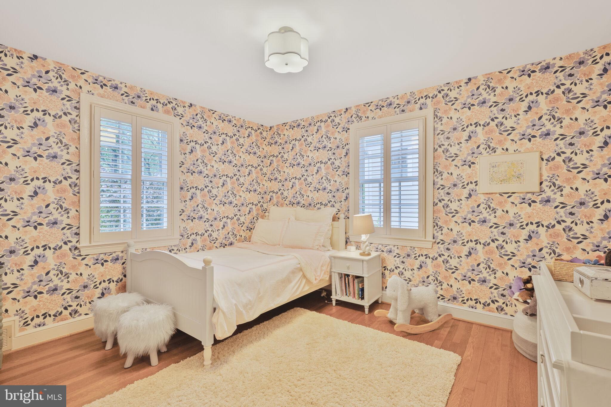 5442 Broad Branch Road Northwest Washington, DC 20015 - Photo 16 of 28 a spacious bedroom with a bed and a window