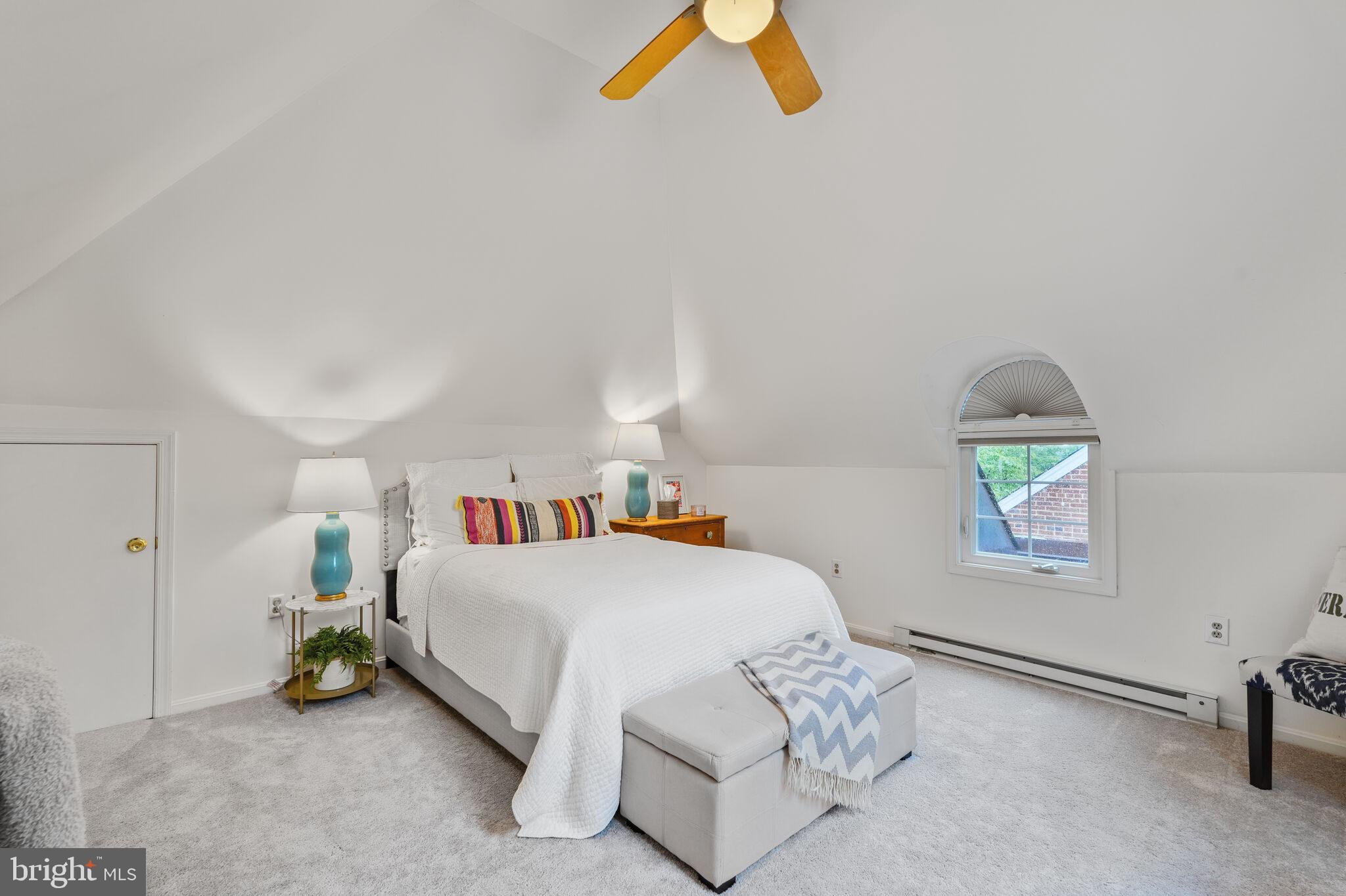 5442 Broad Branch Road Northwest Washington, DC 20015 - Photo 19 of 28 a bedroom with a bed and a chandelier