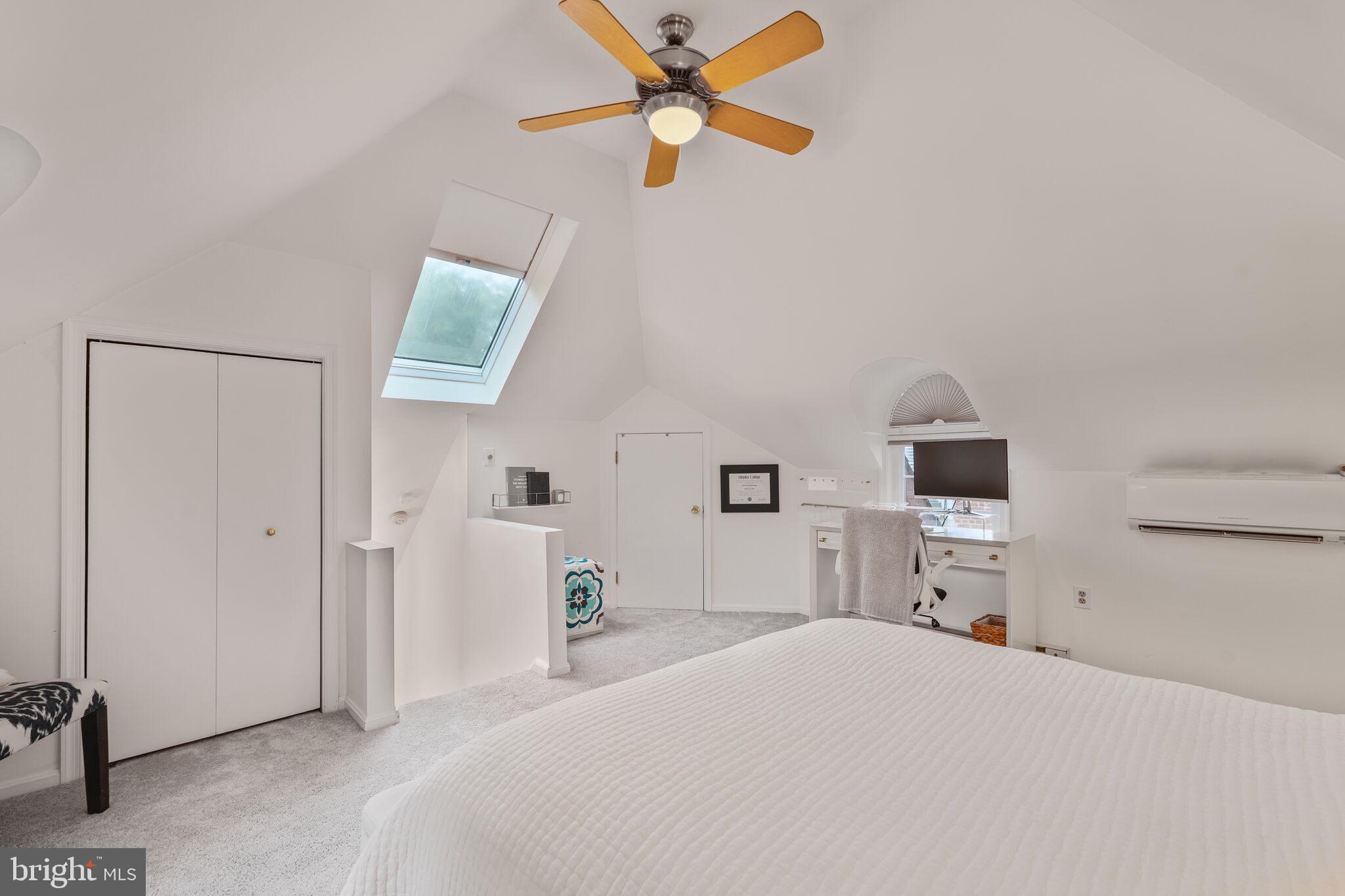 5442 Broad Branch Road Northwest Washington, DC 20015 - Photo 20 of 28 a bedroom with a bed and a tv