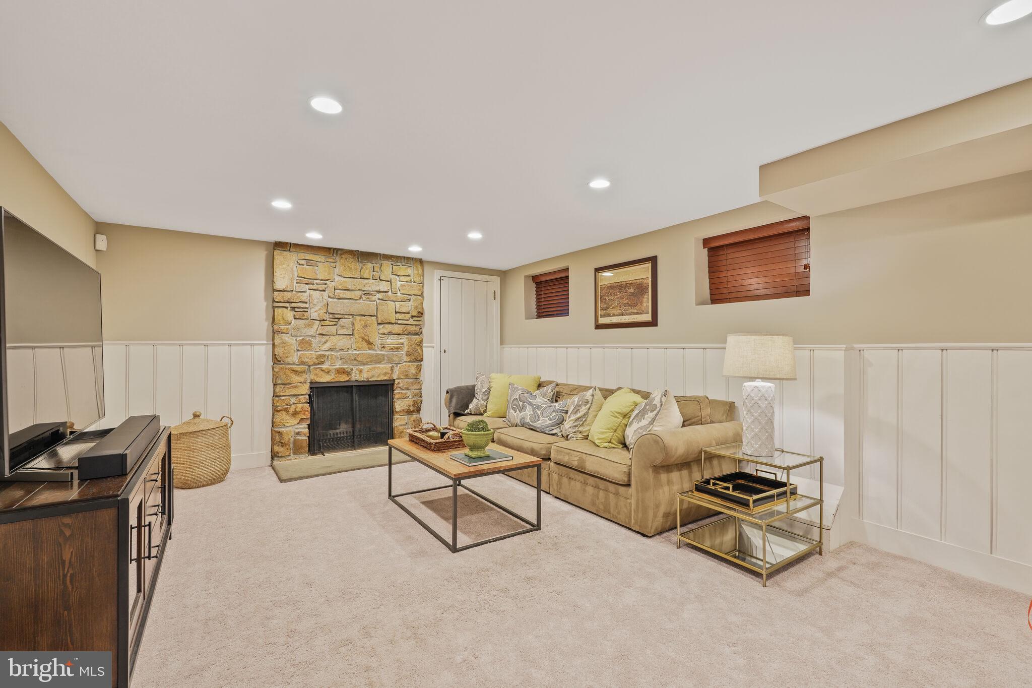 5442 Broad Branch Road Northwest Washington, DC 20015 - Photo 21 of 28 a living room with furniture and a fireplace