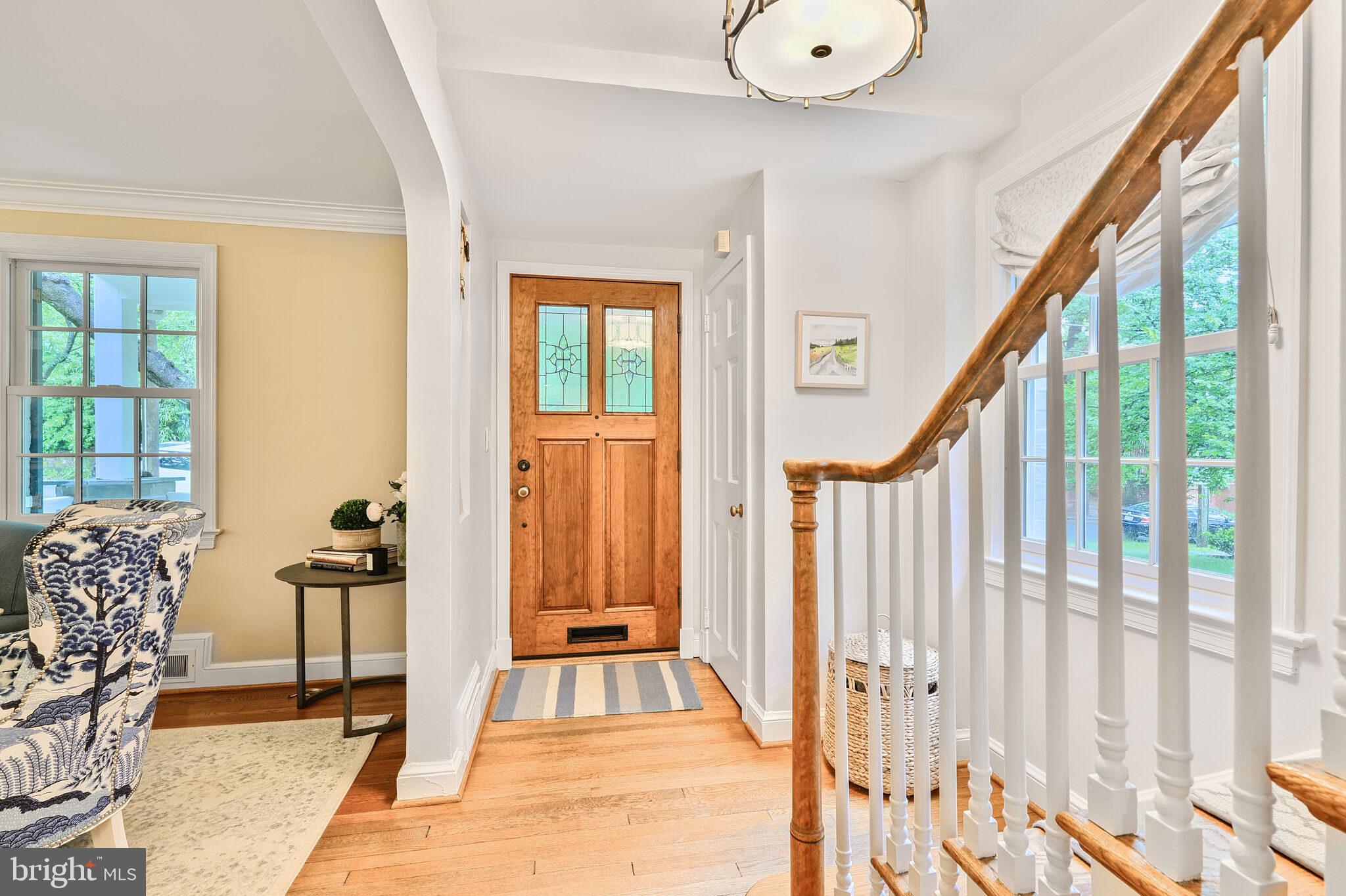 5442 Broad Branch Road Northwest Washington, DC 20015 - Photo 3 of 28 a view of a bedroom with wooden floor and windows