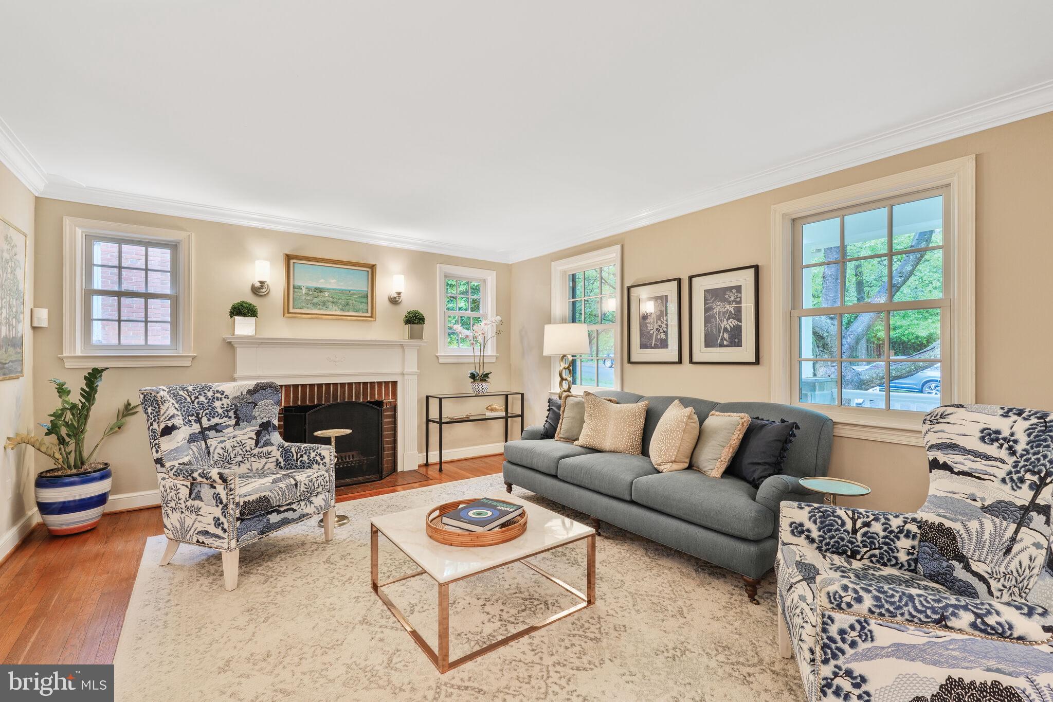 5442 Broad Branch Road Northwest Washington, DC 20015 - Photo 5 of 28 a living room with furniture and a fireplace