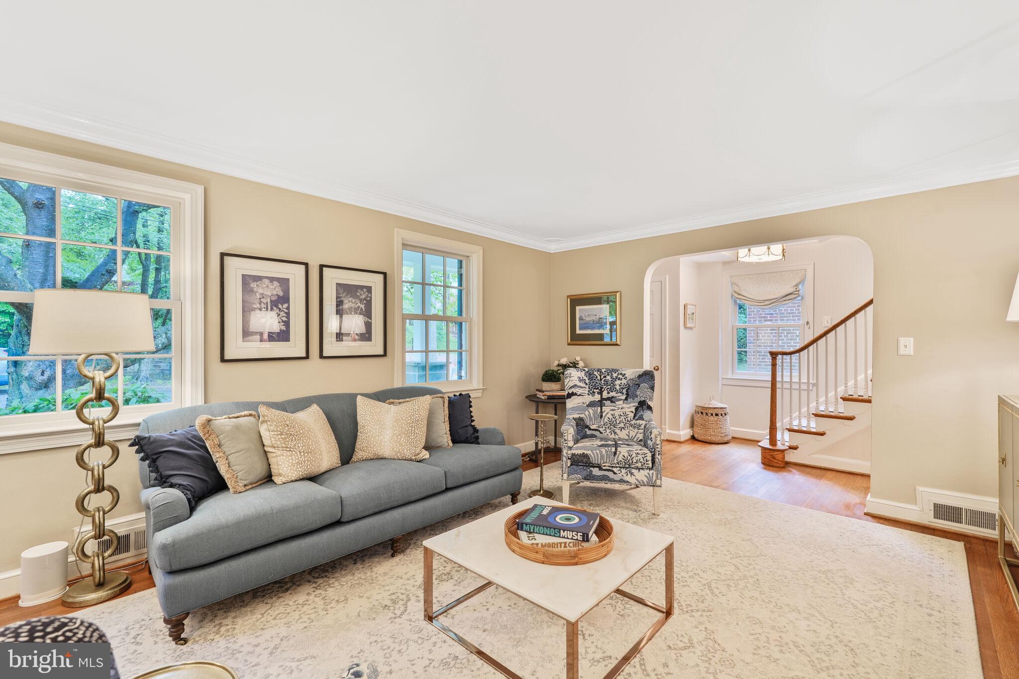 5442 Broad Branch Road Northwest Washington, DC 20015 - Photo 6 of 28 a living room with furniture a rug and a large window