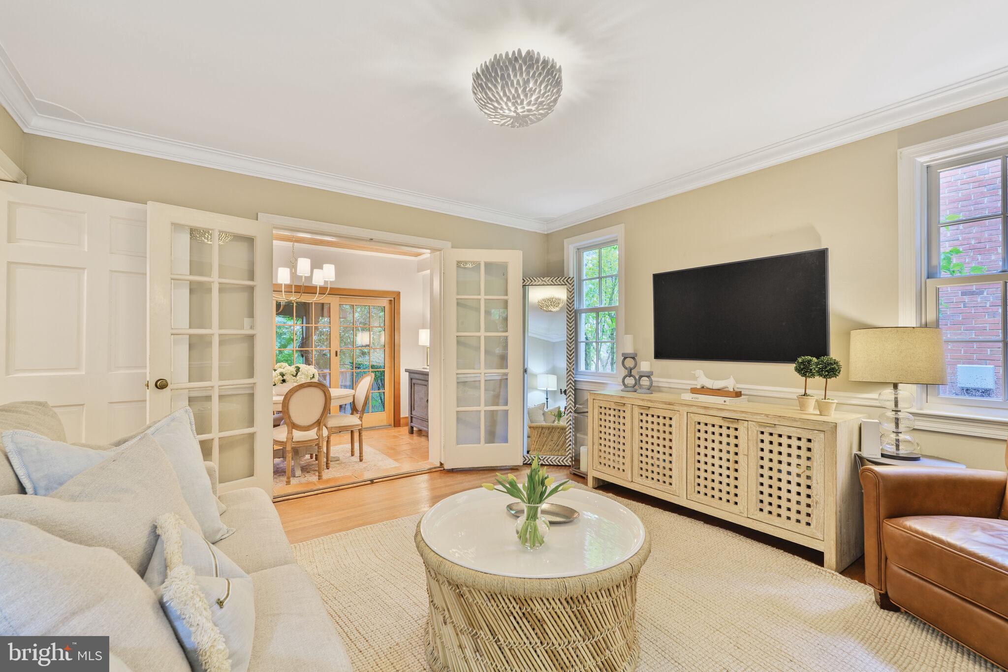 5442 Broad Branch Road Northwest Washington, DC 20015 - Photo 7 of 28 a living room with furniture and a flat screen tv