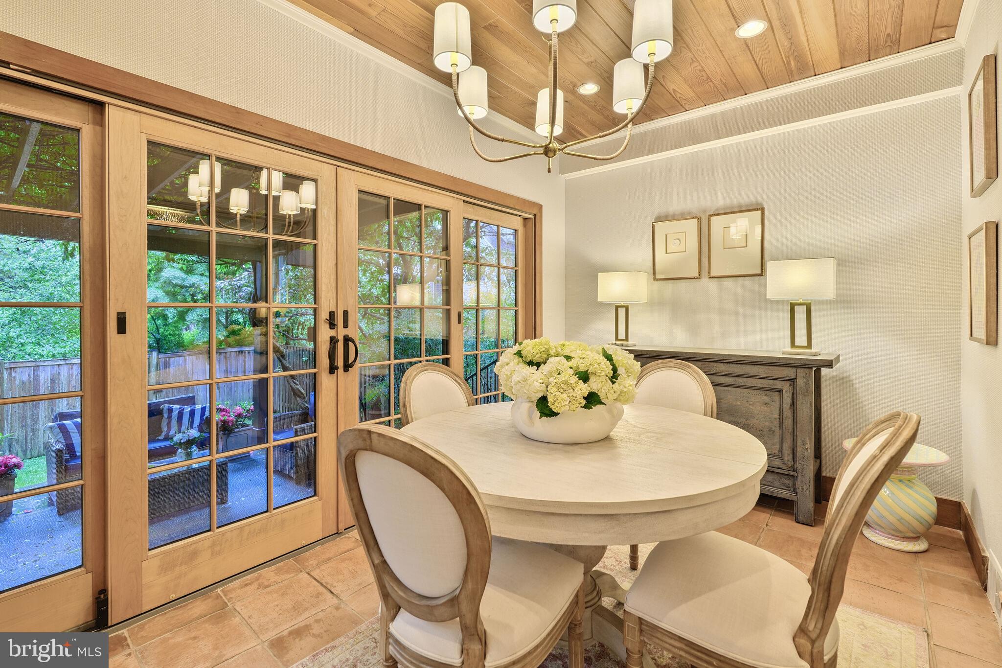 5442 Broad Branch Road Northwest Washington, DC 20015 - Photo 10 of 28 a view of a dining room with furniture window and outside view