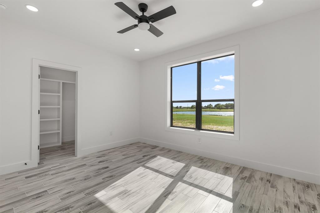 2311 Parker Road Wichita Falls, TX 76310 - Photo 25 of 32 wooden floor in an empty room with a window