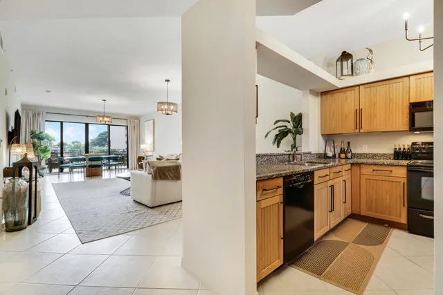 a bathroom with a sink a mirror and a lamp
