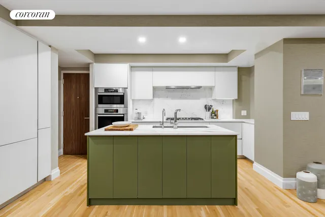 a kitchen with stainless steel appliances granite countertop a sink a stove and a microwave