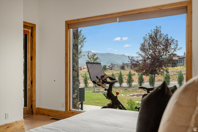 4892 Eagle Rdg Drive Eden, UT 84310 - Photo 20 of 39 Expansive window featuring natural wood trim and a mountain backdrop