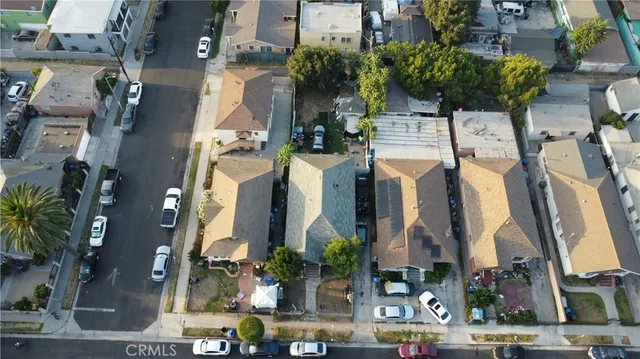 a couple of cars parked in front of buildings
