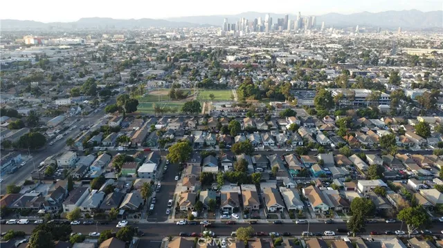 an aerial view of residential building with green space