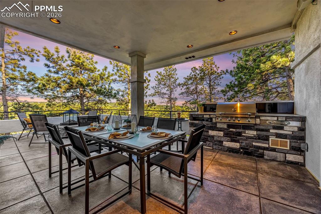 205 Cobblestone Way Monument, CO 80132 - Photo 14 of 45 a outdoor dining space with furniture and outdoor view