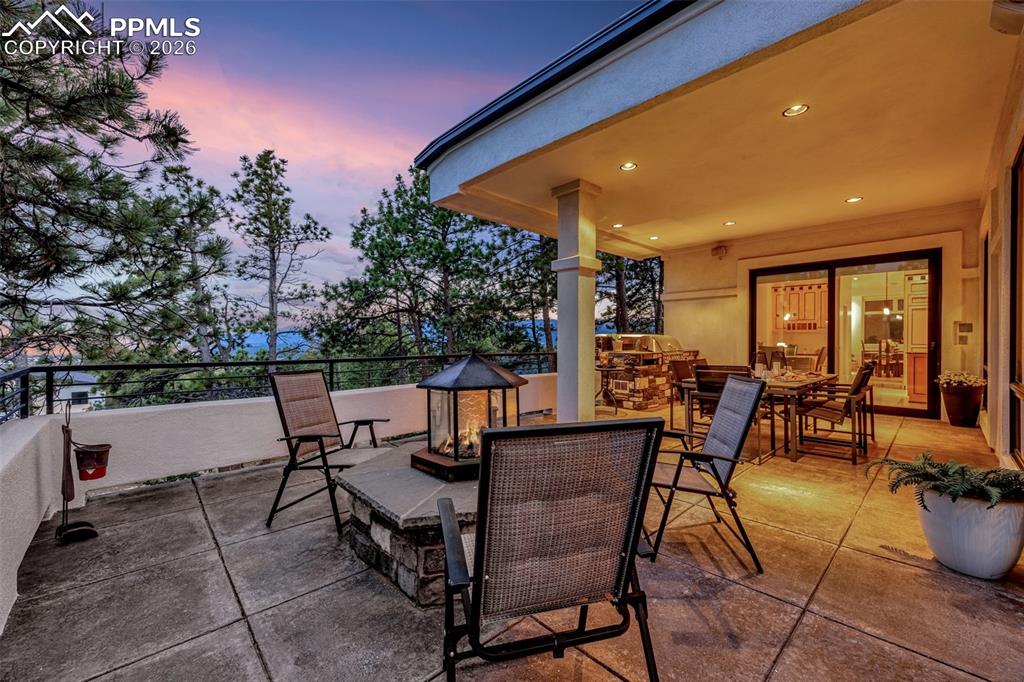 205 Cobblestone Way Monument, CO 80132 - Photo 15 of 45 a view of a patio with table and chairs and potted plants