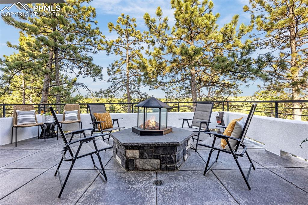 205 Cobblestone Way Monument, CO 80132 - Photo 17 of 45 a view of a chairs and table on the terrace