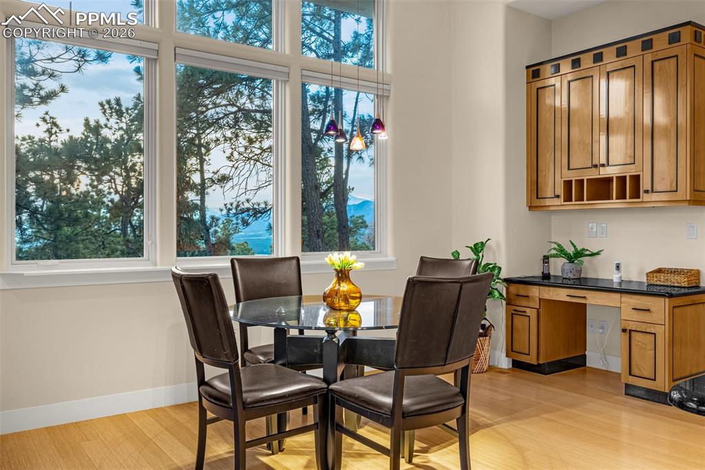 205 Cobblestone Way Monument, CO 80132 - Photo 18 of 45 a view of a dining room with furniture window and outside view