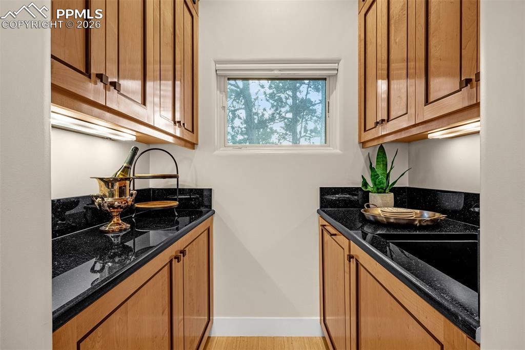 205 Cobblestone Way Monument, CO 80132 - Photo 19 of 45 a kitchen with stainless steel appliances granite countertop a stove and a sink