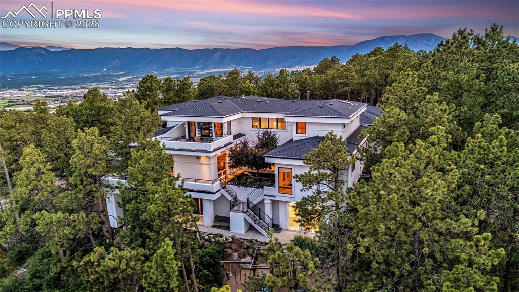 205 Cobblestone Way Monument, CO 80132 - Photo 2 of 45 an aerial view of a house with a garden