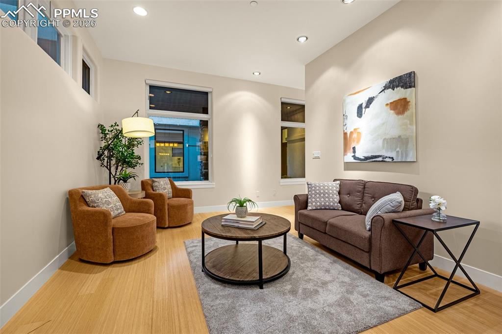 205 Cobblestone Way Monument, CO 80132 - Photo 21 of 45 a living room with furniture and a potted plant