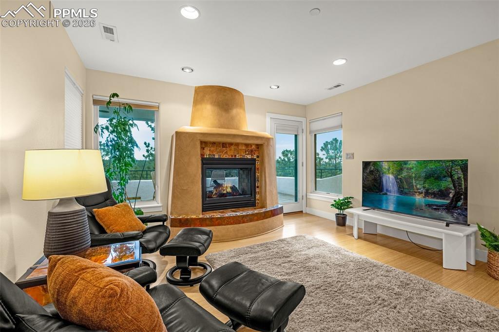 205 Cobblestone Way Monument, CO 80132 - Photo 22 of 45 a living room with furniture and a fireplace