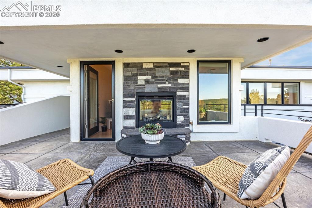 205 Cobblestone Way Monument, CO 80132 - Photo 24 of 45 a living room with a couch and a table