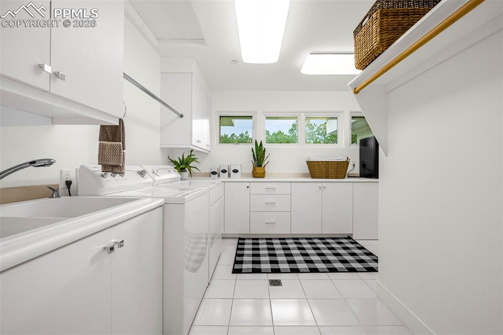 205 Cobblestone Way Monument, CO 80132 - Photo 29 of 45 a kitchen with a sink a stove cabinets and window