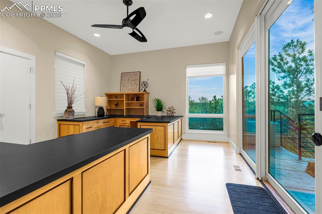 205 Cobblestone Way Monument, CO 80132 - Photo 32 of 45 a kitchen with stainless steel appliances granite countertop a stove a sink and a refrigerator