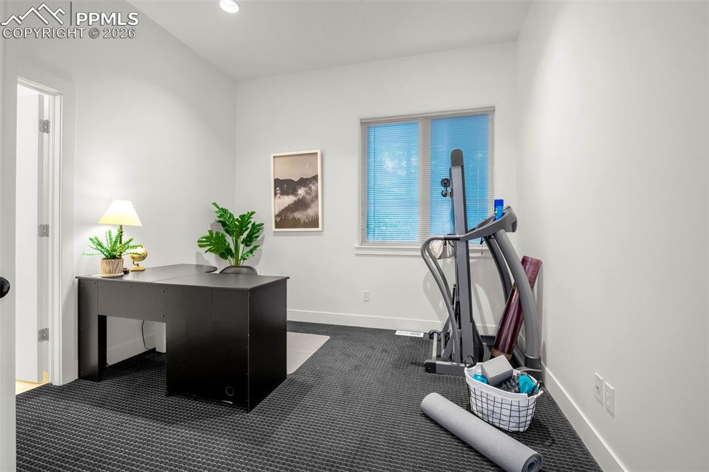 205 Cobblestone Way Monument, CO 80132 - Photo 33 of 45 a view of hall way with furniture and gym equipment