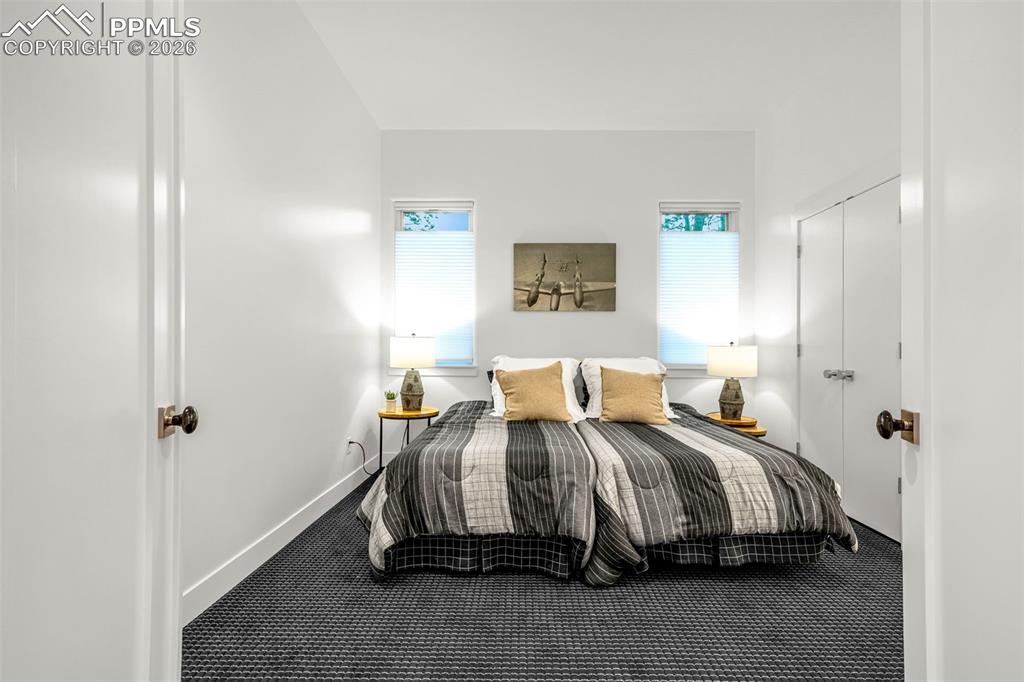 205 Cobblestone Way Monument, CO 80132 - Photo 34 of 45 a bedroom with a bed and a window