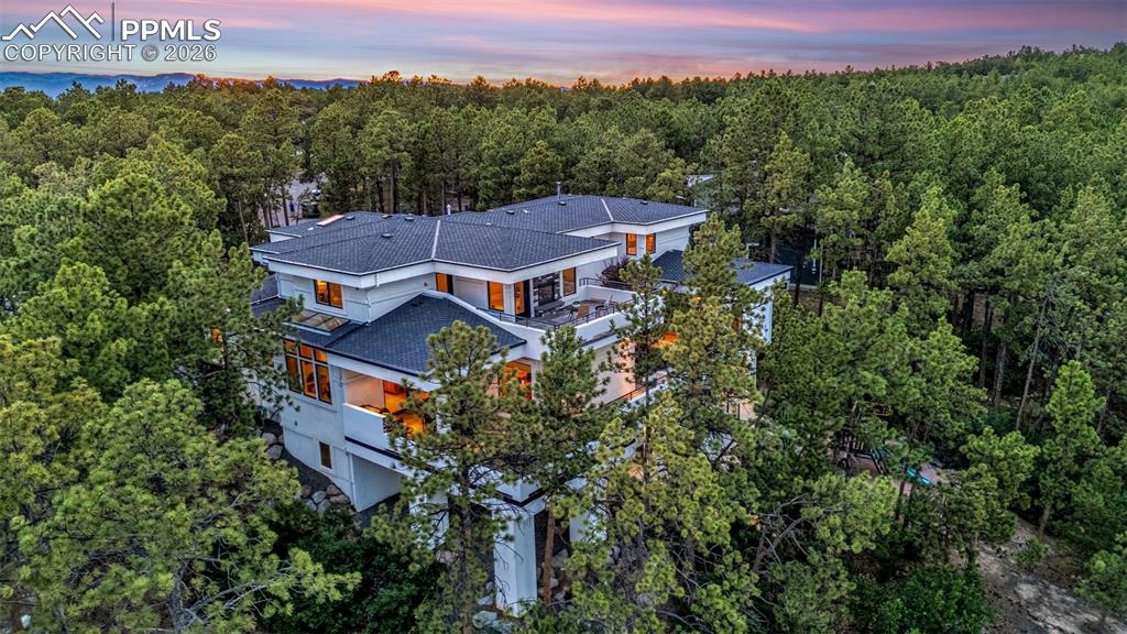 205 Cobblestone Way Monument, CO 80132 - Photo 42 of 45 an aerial view of a house with a yard and mountain view