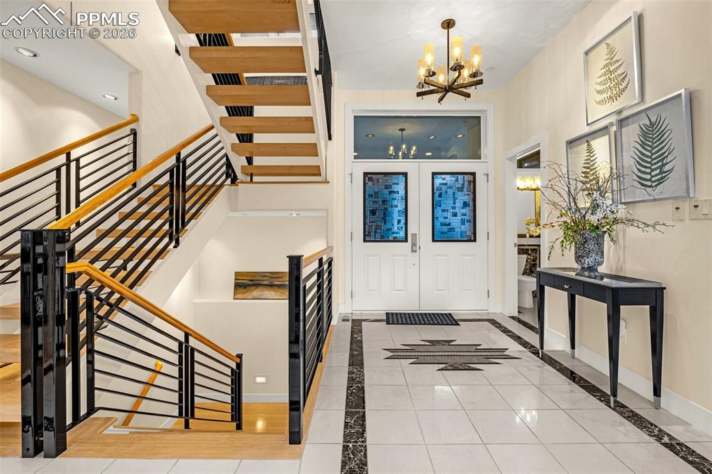 205 Cobblestone Way Monument, CO 80132 - Photo 7 of 45 a view of an entryway with wooden floor