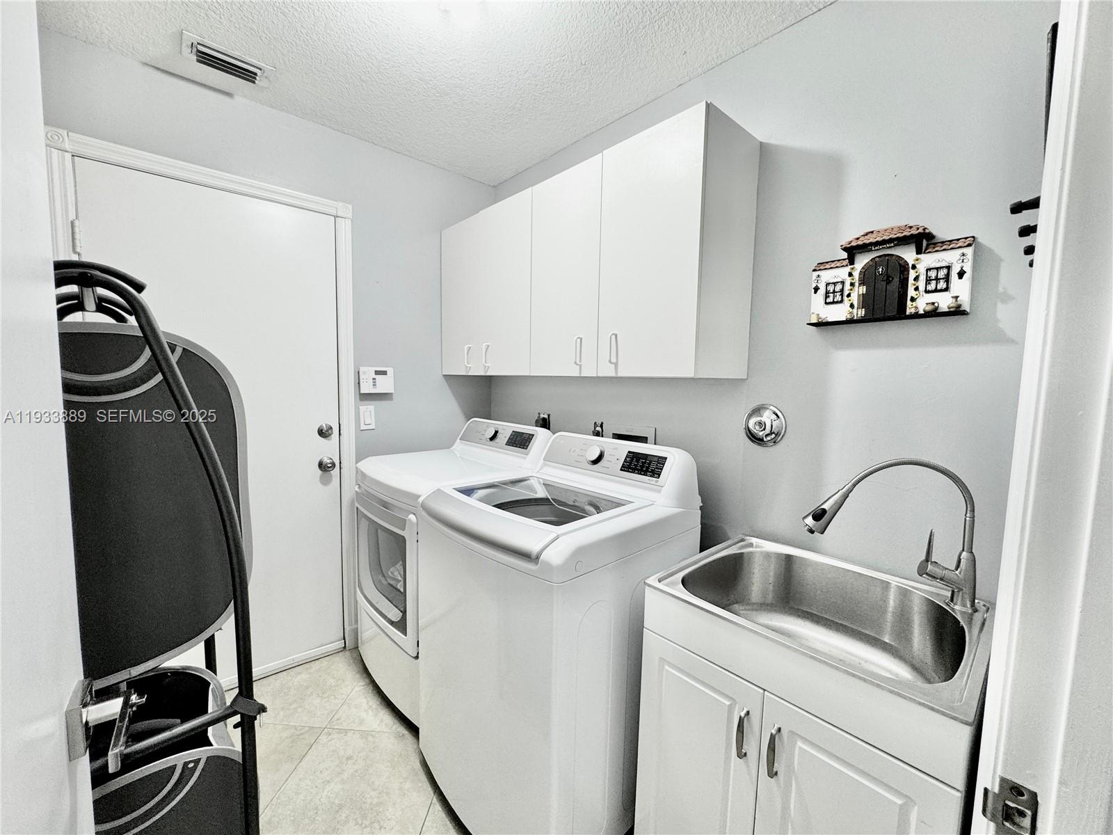 19754 Dinner Key Drive Boca Raton, FL 33498 - Photo 22 of 48 a kitchen with stainless steel appliances granite countertop a sink stove and refrigerator