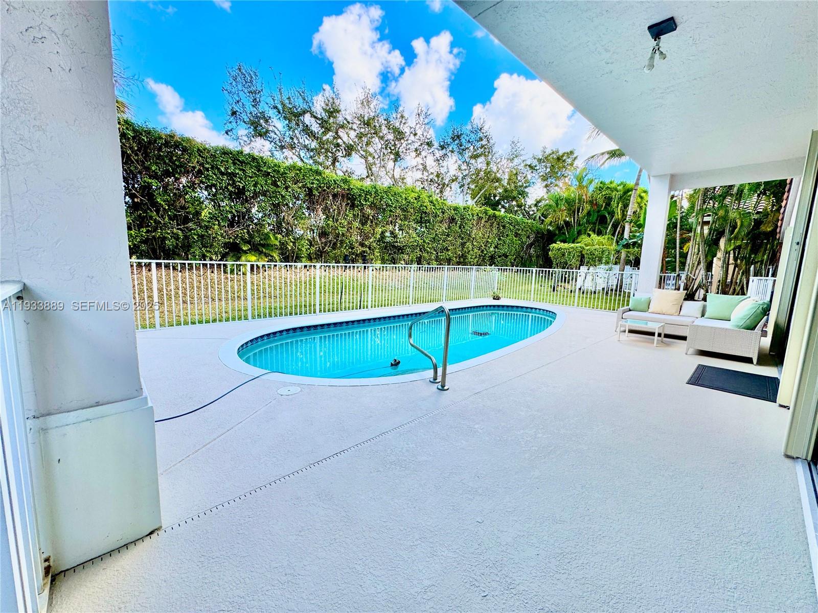 19754 Dinner Key Drive Boca Raton, FL 33498 - Photo 24 of 48 an outdoor space with swimming pool